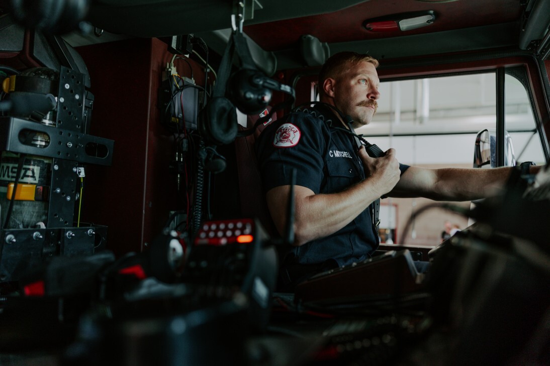 firefighter driving fire engine