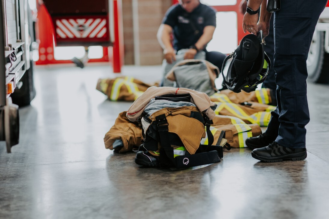 firefighters inspecting gear